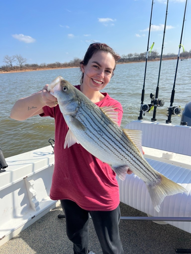 Guest holding a fish during a Lake Texoma fishing trip
